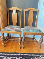 Front view of both chairs showing frames and seat upholstery