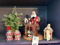 Full lot view showing tree, Santas, ceramic sacks