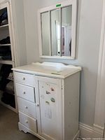 Front view of dresser with mirror mounted above