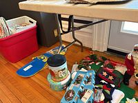 Full view of table underside showing steel folding legs and resin top