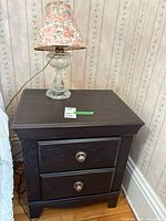 Side table with lamp on top showing overall appearance