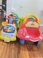 Front view of both ride-on cars side by side showing overall design and colours