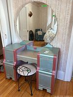 Full view of vanity with mirror and chair in front