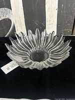 Top view showing radiating petal ridges and central well