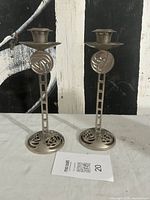 Both chrome-plated candlesticks front view