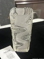 Front view of clear and frosted pressed glass vase