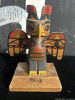 Front view of thunderbird totem on base