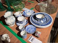 Group shot showing all blue and white porcelain pieces within green tape boundary