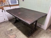 Full view of dining table extended in kitchen setting