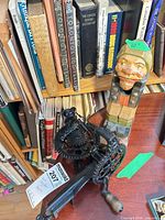 Both nutcrackers on shelf with books