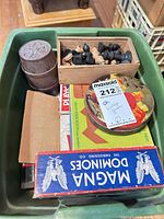 Top view showing domino box, chess pieces, barrel, tin, additional boxes
