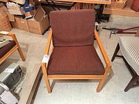 Front view of armchair showing cushions and frame