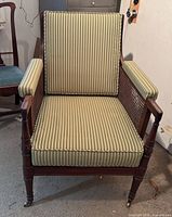 Front view of chair with cushions and casters visible