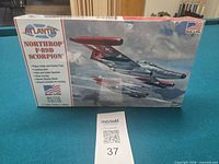 Front view of sealed Atlantis Northrop F-89D Scorpion model kit box on table