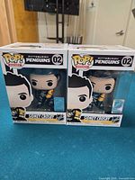 Front view of two boxed Funko Pop! Sidney Crosby figures