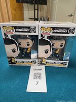 Front view of both boxed Sidney Crosby Funko Pop! figures