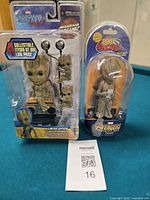 Front view of both sealed Groot packages on table