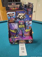 Front of boxed Rocket action figure showing packaging and figure