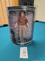 Front view of packaged James Dean doll showing figure and outfit