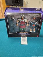 Front view of boxed Ram Man figure and accessories