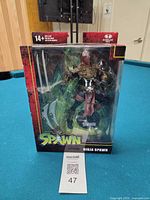 Front of sealed Ninja Spawn action figure box showing figure and accessories