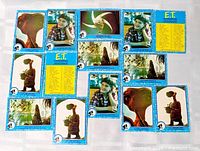 Group view of all 11 E.T. trading cards laid out