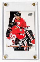 Card in screw-down acrylic case, full view