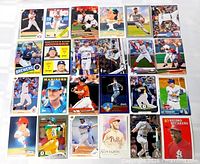 Top-down shot of all 24 baseball cards laid out 6×4