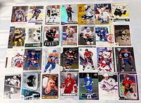 All 28 hockey cards laid out in four rows