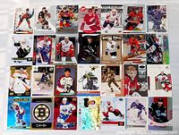 All 28 hockey cards laid out in four rows