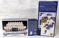 Front and side view of two Kraft Dinner boxes showing hockey card panels