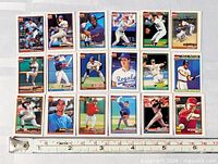 first overview of 17 miniature Topps baseball cards beside ruler showing size