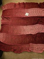 Full view of crocheted throw showing color pattern and texture