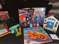 All items grouped: books, key house toy, bubble blower, stencil kit, Play-Doh eggs