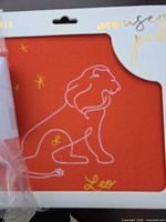 Front of sealed URB Leo zodiac red mouse pad with white line-art lion design
