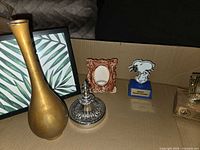 Group shot showing brass vase, framed bamboo art, Princess House stand, ceramic photo frame, Snoopy trophy