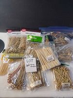 Group view showing multiple packages of bamboo knot picks, paddle skewers, and beaded skewers