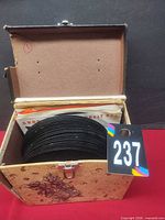 Record box opened showing stack of 7-inch records inside