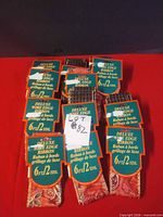 Group of packaged Deluxe wired-edge ribbons showing quantity