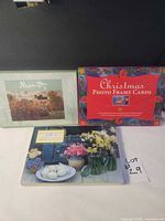 Front view of three boxed greeting card sets