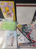 Overview of lot with gift wrap, letterhead, cards, envelopes
