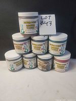 All eight Demco finger paint jars stacked