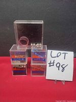 Five clear cube puzzles stacked; four with ANSA Rent-A-Car labels, one plain on top