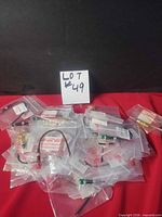 Assorted sealed LED indicator packs spread out with lot number card