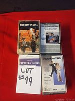 Group shot of four cassettes: When Harry Met Sally, Howie MacDonald, Top Hits of the 50s, Moonlighting