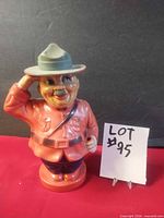 Front view of ceramic Mountie coin bank