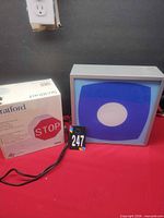 Stop-sign lamp box beside blue graphic lamp