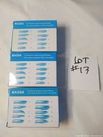 Front of three Magna boxes showing blade shapes and counts