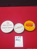 All three tobacco tins side-by-side
