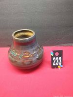 Front view of stoneware vase showing glaze and shape